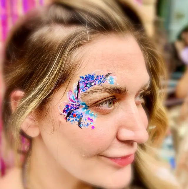 Blue and pink glitter around the eye