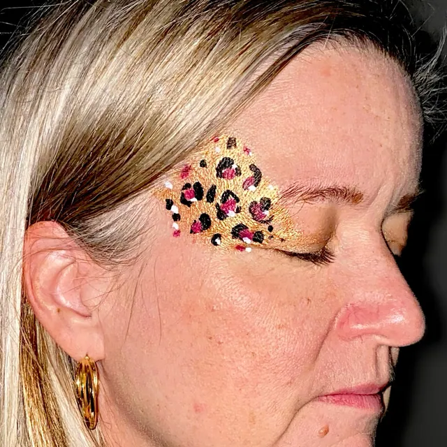 Pink and black leopard-print eye design with gold glitter
