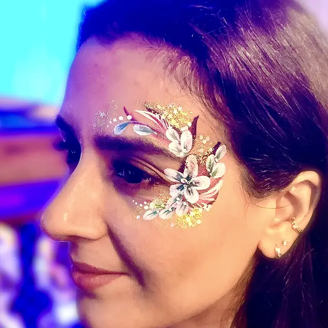 Silver festival eye design with glitter and leaf-shaped gems