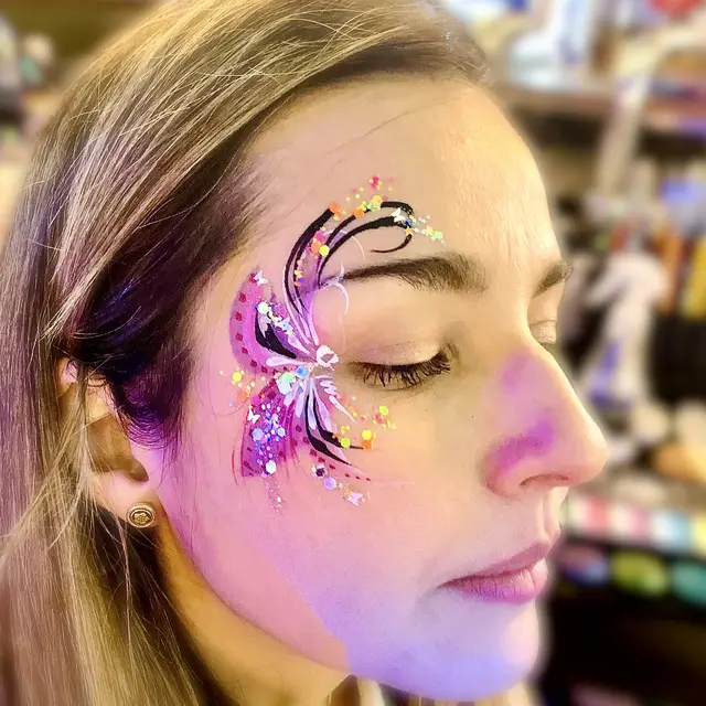 Purple floral eye design with glitter accents