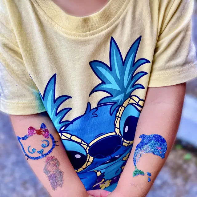 Blue glitter band design on a forearm
