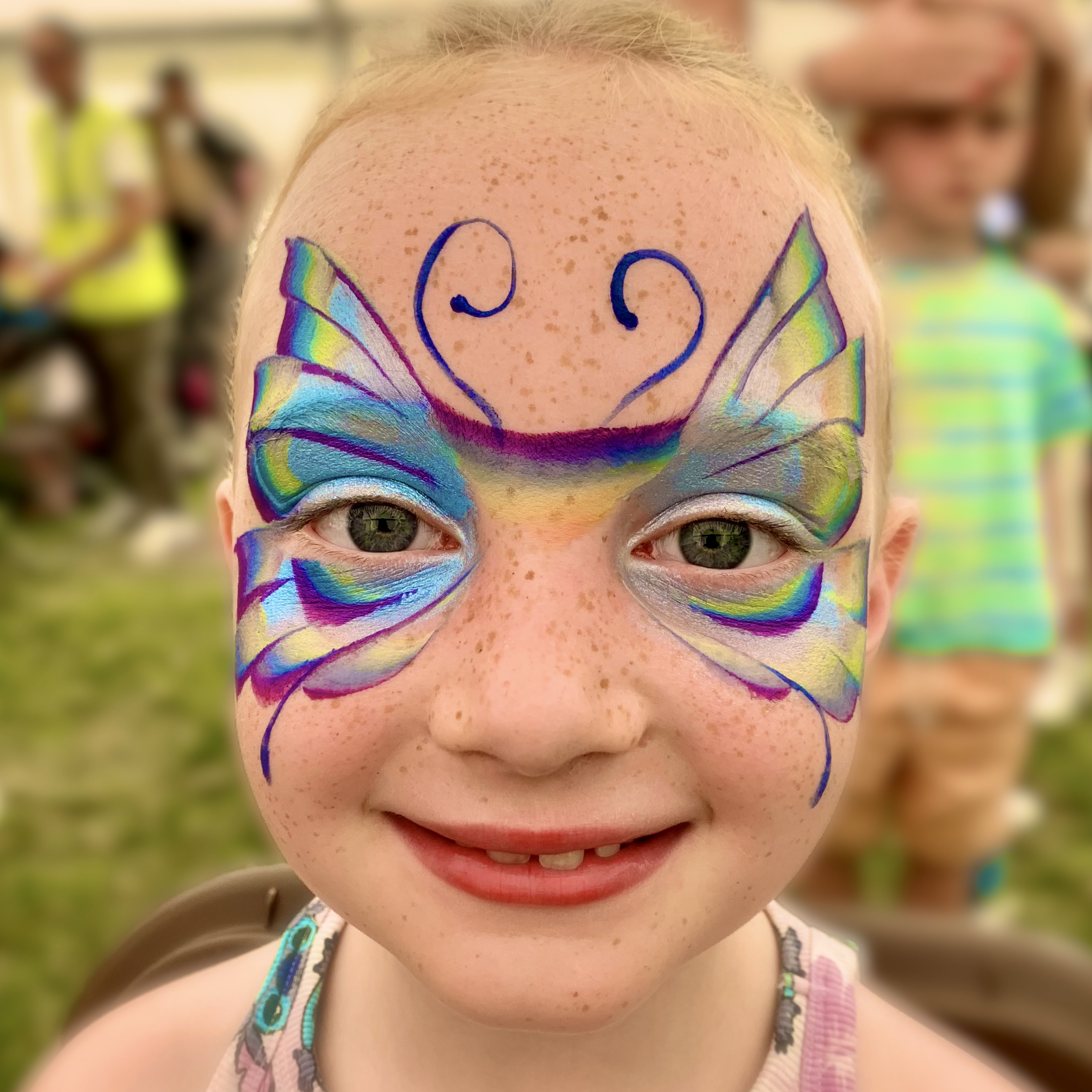 Children's butterfly face paint at a birthday party in Sale, Manchester
