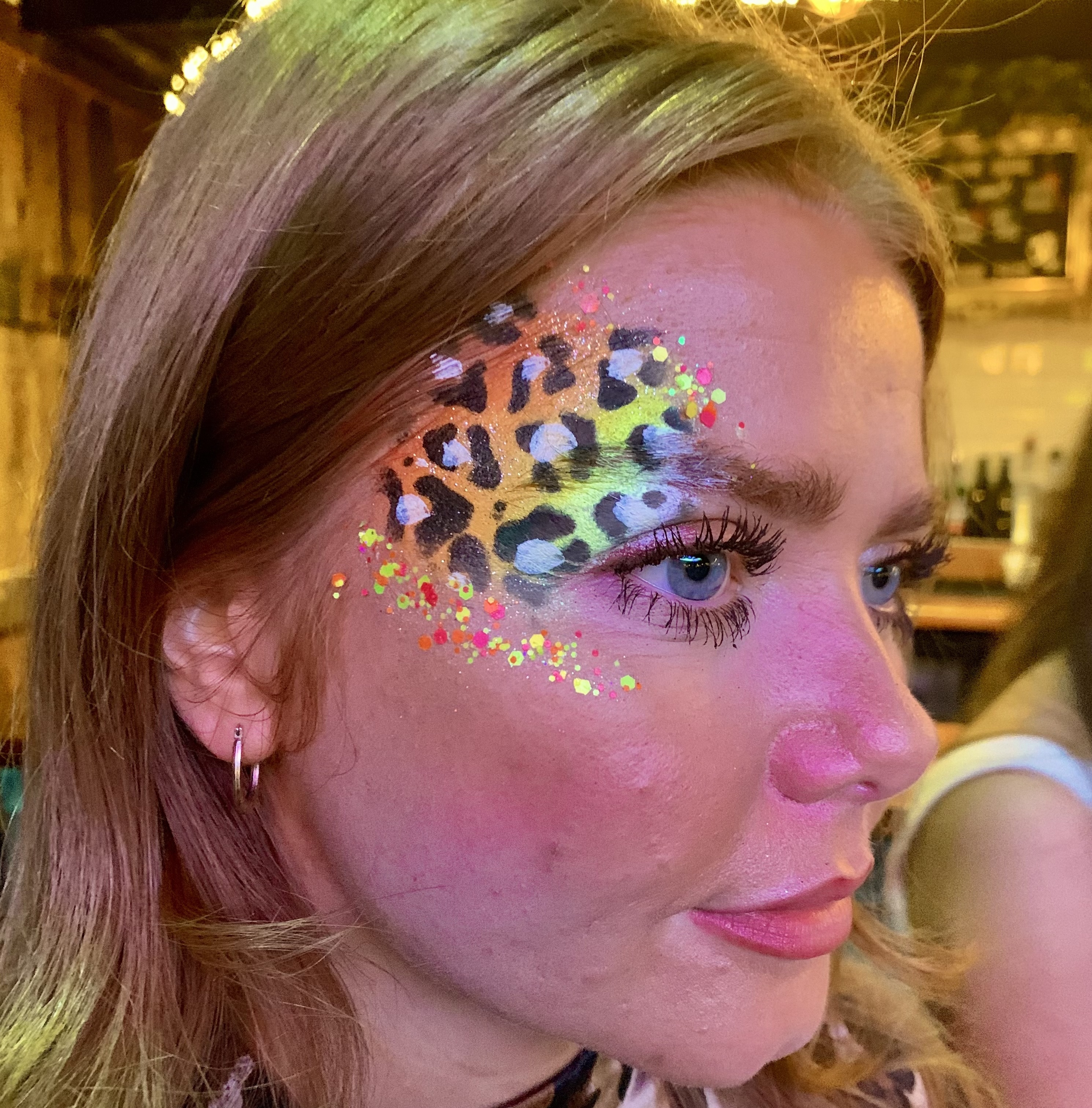 Neon UV face painting for a disco party in Stockport