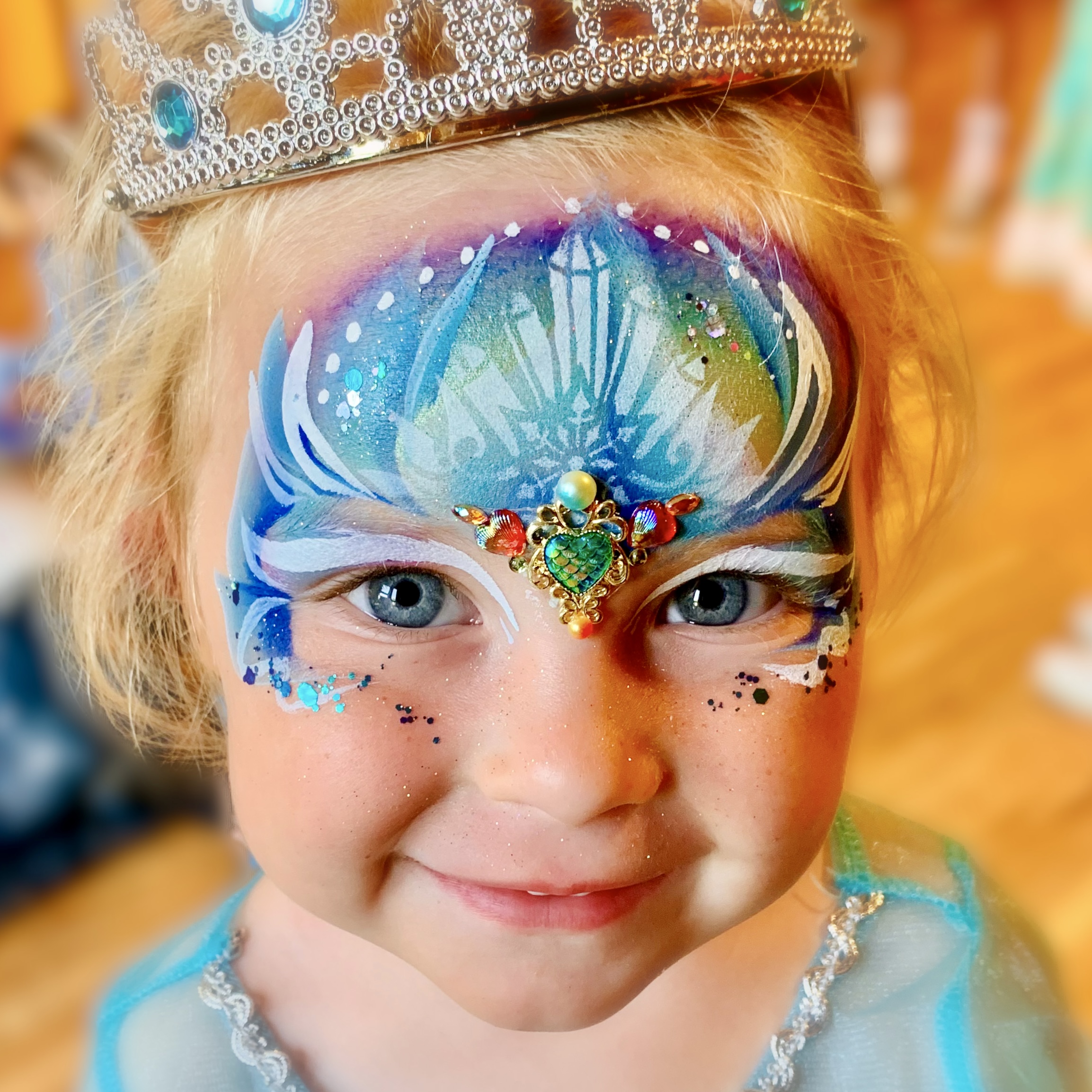 Face gems application at a festival in Manchester